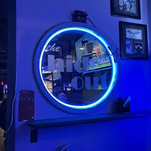 a round mirror with a blue light