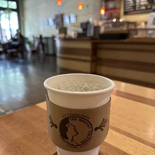 a cup of coffee on a table