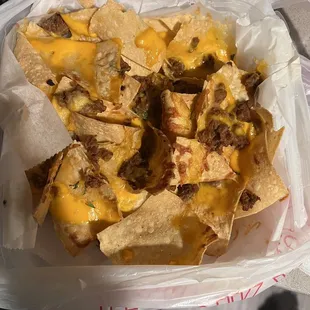 Nachos Everything on the side. What proteins is here so they&apos;re soggy.