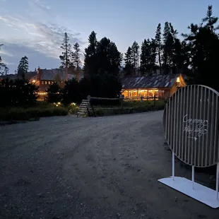 Night picture of the barn, Lodge, and Saloon