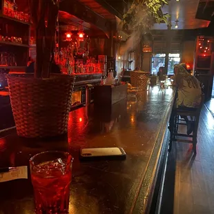 a woman sitting at the bar