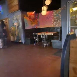 a woman walking through a restaurant