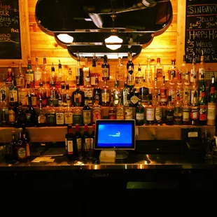 a laptop on a bar counter