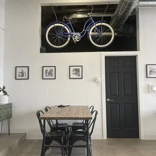 a bicycle hanging from the ceiling