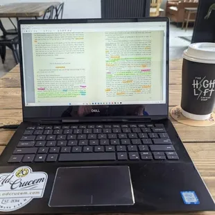 a laptop and a cup of coffee
