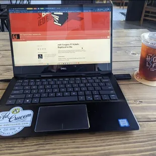a laptop and a drink