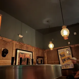 a restaurant counter with a sign on it