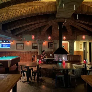 Cozy fireplace in the center.