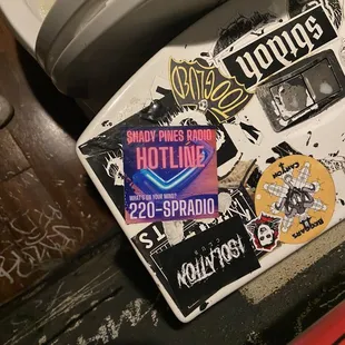 a toilet covered in stickers