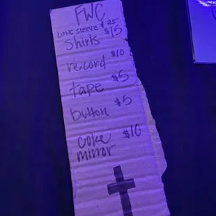 a note with a cross on it