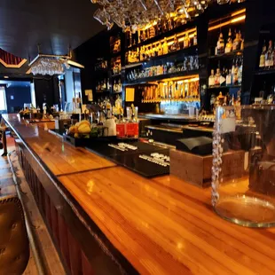 a bar with lots of bottles of alcohol