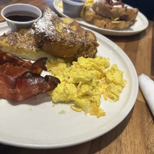 Brioche French toast scrambled eggs with cheese, bacon and friend potatoes(not pictured BUSSIN.