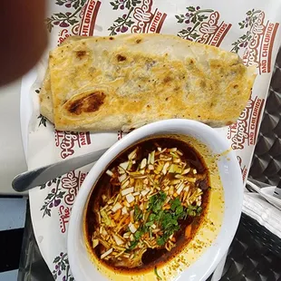 a bowl of soup and bread