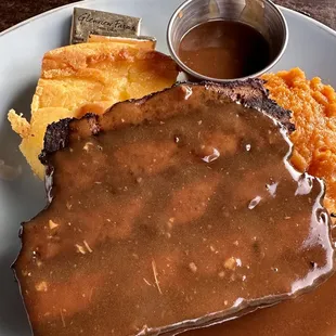 Homemade Meatloaf Plate with spoon bread and mashed sweet potatoes.