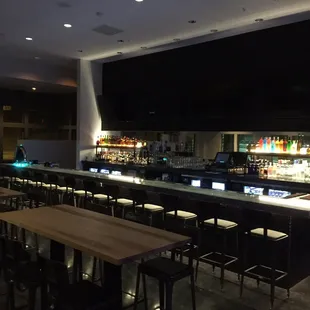 a bar with a lot of stools