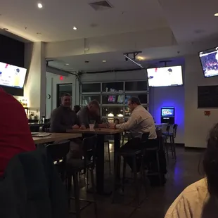 a group of people sitting at a bar