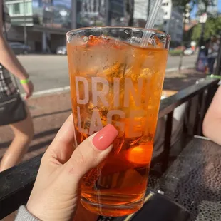 a person holding a drink