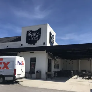 a fedex truck parked outside of the store
