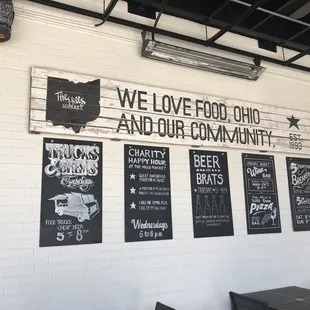 a brick wall with a sign that says we love food ohio and our community