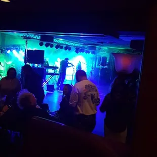 a group of people sitting at a bar