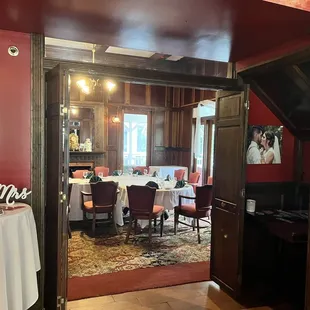 a dining room with red walls
