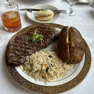 Waygu steak, southern rice, baked potato and an old fashioned