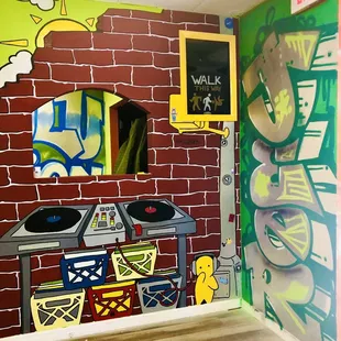 a brick wall with graffiti