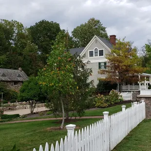 House with cottage behind