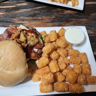 Bacon cheese burger Kaiser roll and extra crisp tater tots!