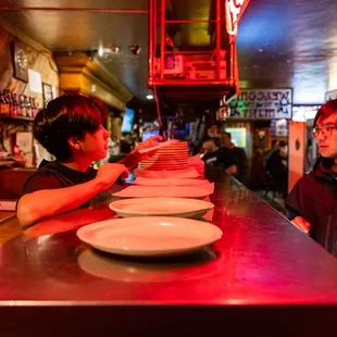 a man and a boy at a bar