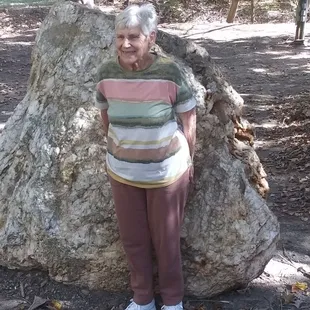 Grandma next to a giant piece of quartz