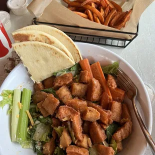 Buffalo chicken salad extra protein with sweet potato fries.