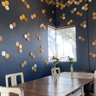 a dining room with a table and chairs
