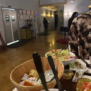 a man sitting at a table full of food