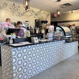 a man and a woman behind a counter