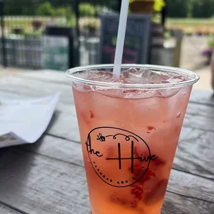a drink with strawberries and lemonade