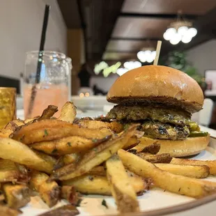 a burger and fries on a plate