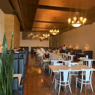 View from entrance, tables and booths! Large private dining room behind back wall (where the neon sign is).