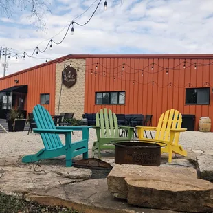 colorful chairs around a fire pit