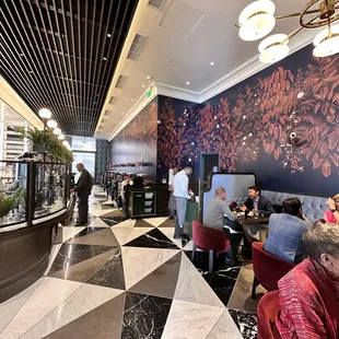 people sitting at tables in a restaurant