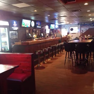 a bar with tables and chairs