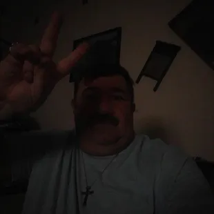 a man making a peace sign