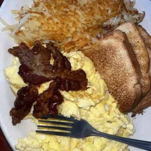 2 Eggs with 2 Bacon Breakfast  It comes with hasbrowns or Tator tots and your choice of bread or pancake