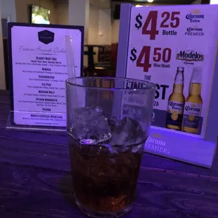 a glass of soda on a table