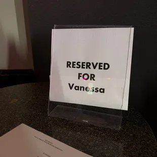 a reserved sign on a table