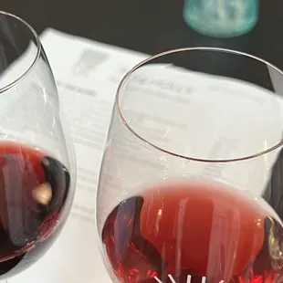 two glasses of wine on a table