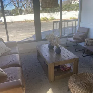 a living room with couches and a coffee table