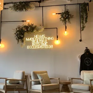 a room with chairs and a sign