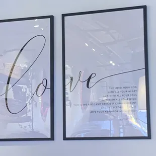 a couple of framed posters