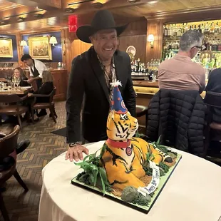 Jorge Possesses with Tiger  Cake